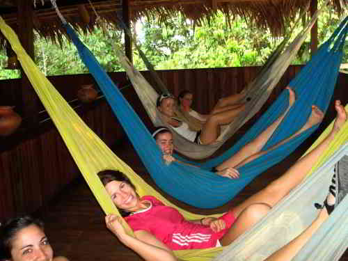 5 ECUADOR AMAZON TOURS [FROM QUITO]: Resting in hamacs at the Cuyabeno Lodge when visiting the Amazon in Ecuador.
