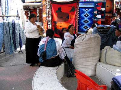 7 BEST ART, HANDICRAFTS MARKETS OF ECUADOR: Otavalo women in tradtional dresses
