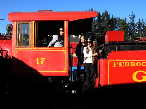 ECUADOR DEVILS NOSE: Passengers enjoying having their picture taken at the steam locomotive in Quito. 