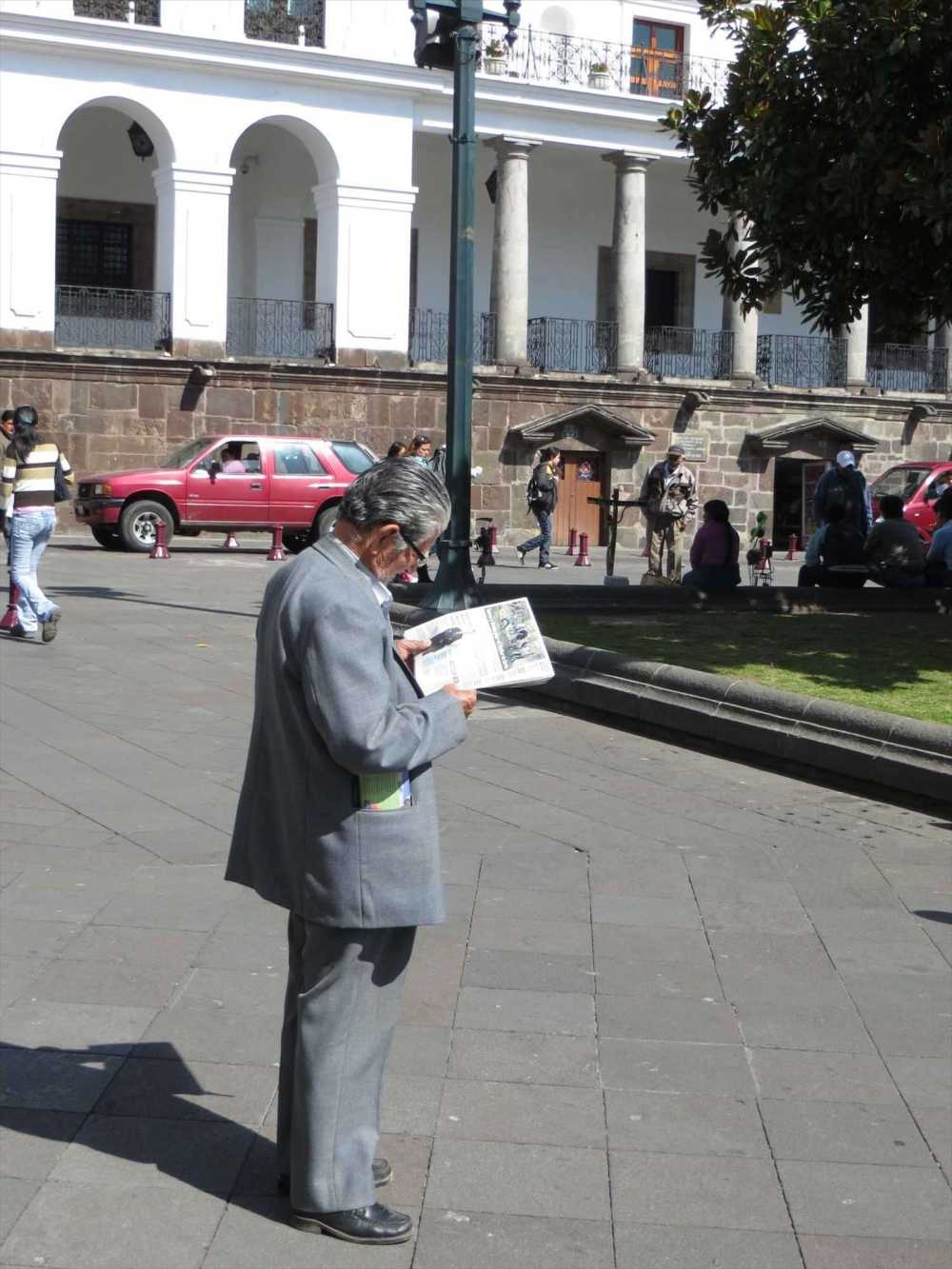 Elderly man reading a  newspaper