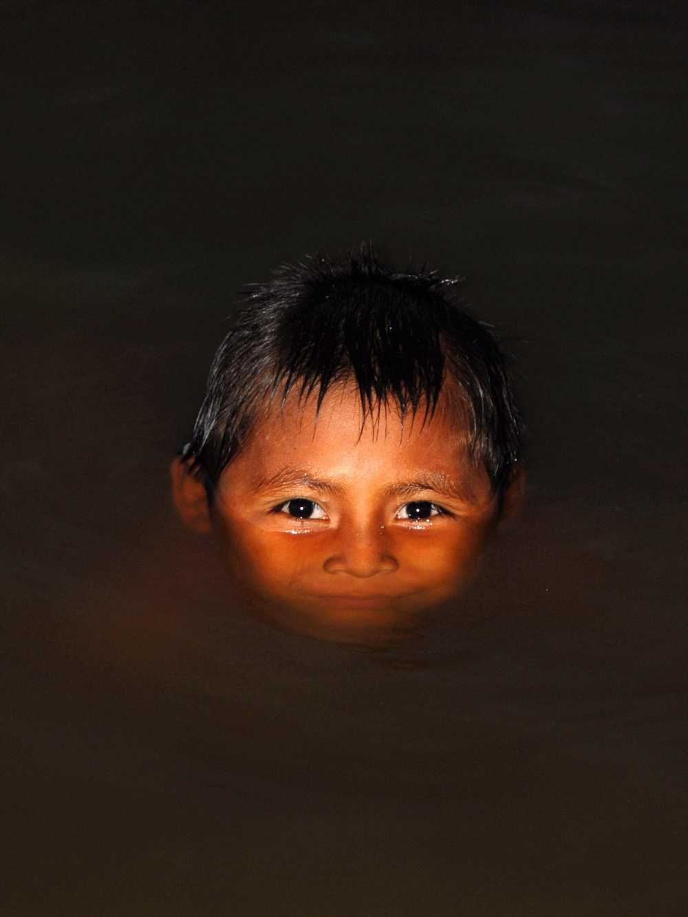 Secoya child swimming