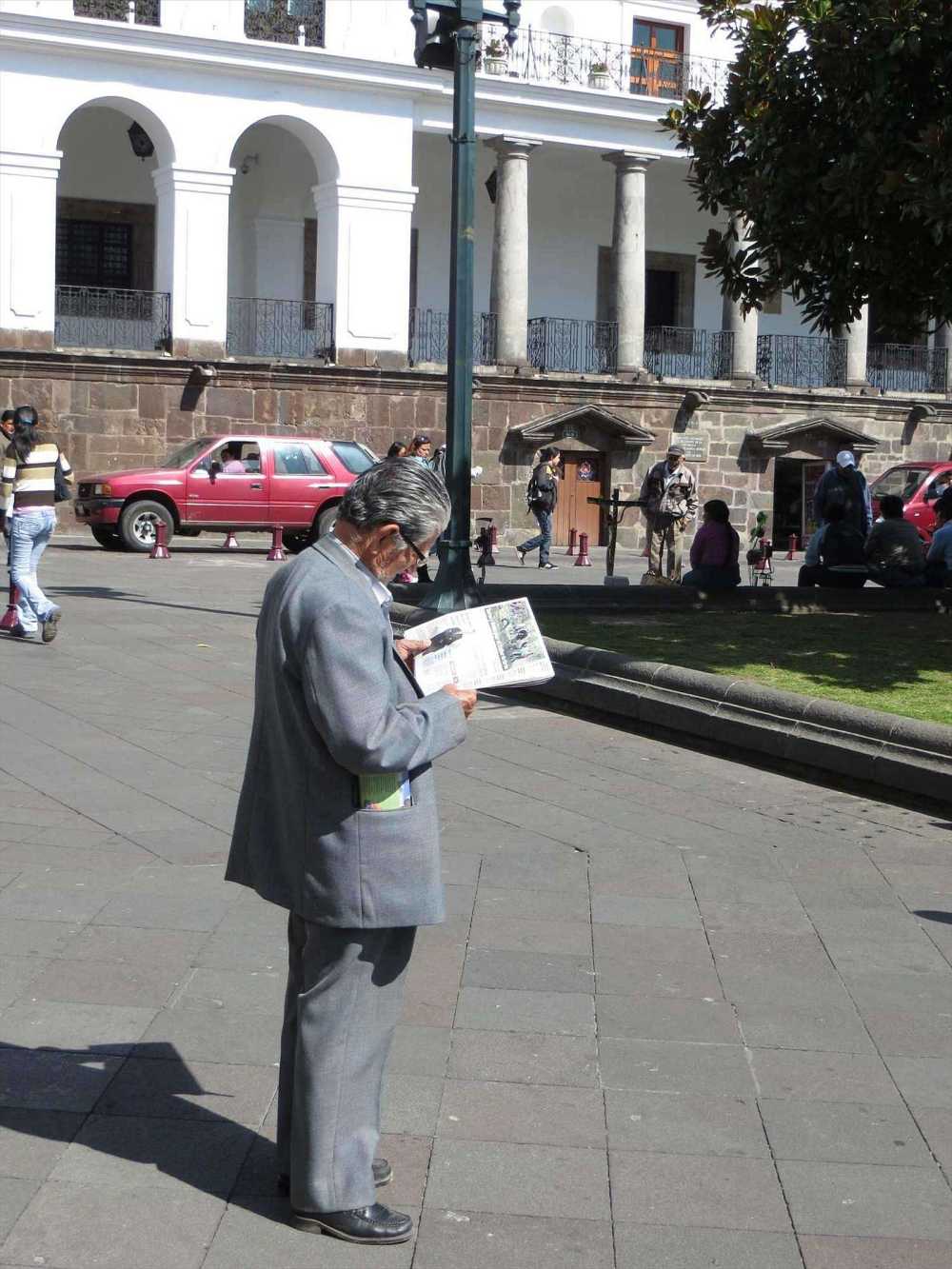Elderly man reading a  newspaper